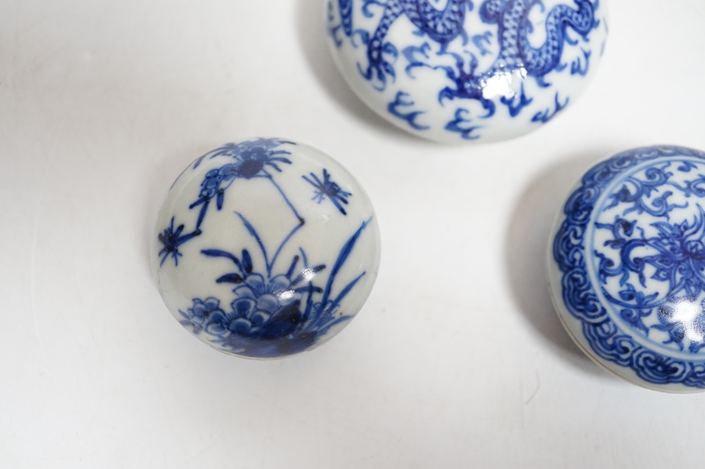 Three Chinese blue and white seal paste boxes and covers, Qing dynasty, largest 7cm in diameter
